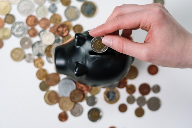 Black Piggy Bank and Coins